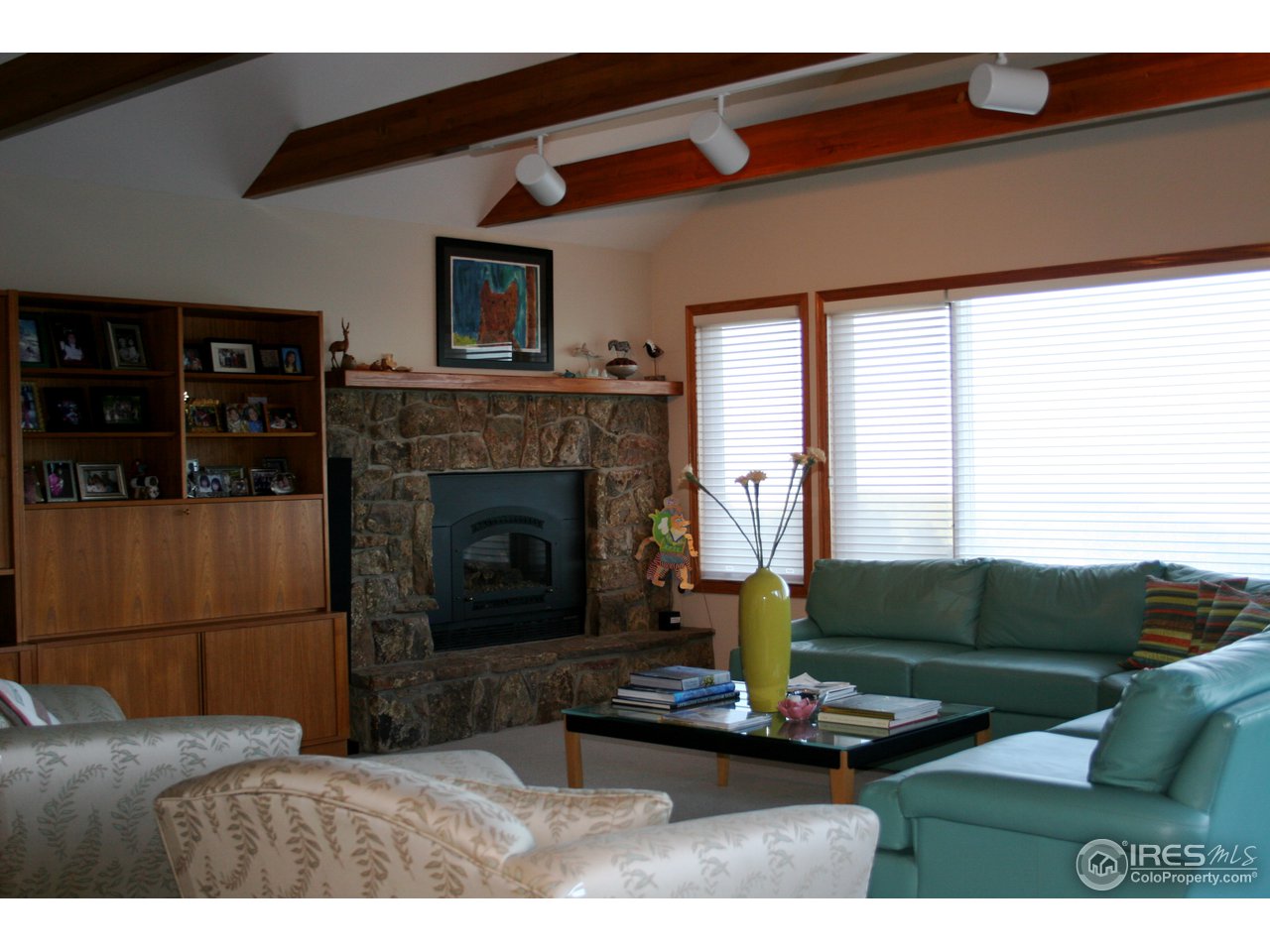 716 Brook Road Boulder, CO 80302 - Photo 8 of 25 a living room with furniture and a fireplace