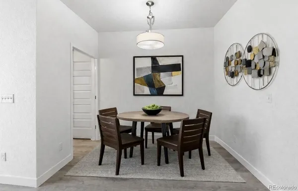 a dining room with furniture and window