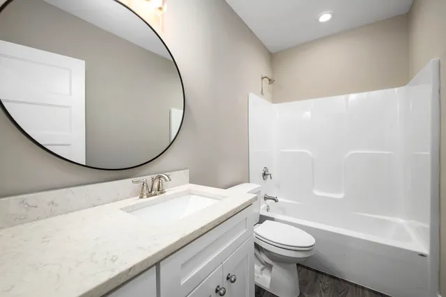 a view of a kitchen with a sink and cabinets