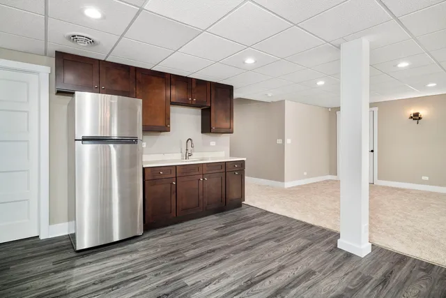 a view of a house with a yard and deck