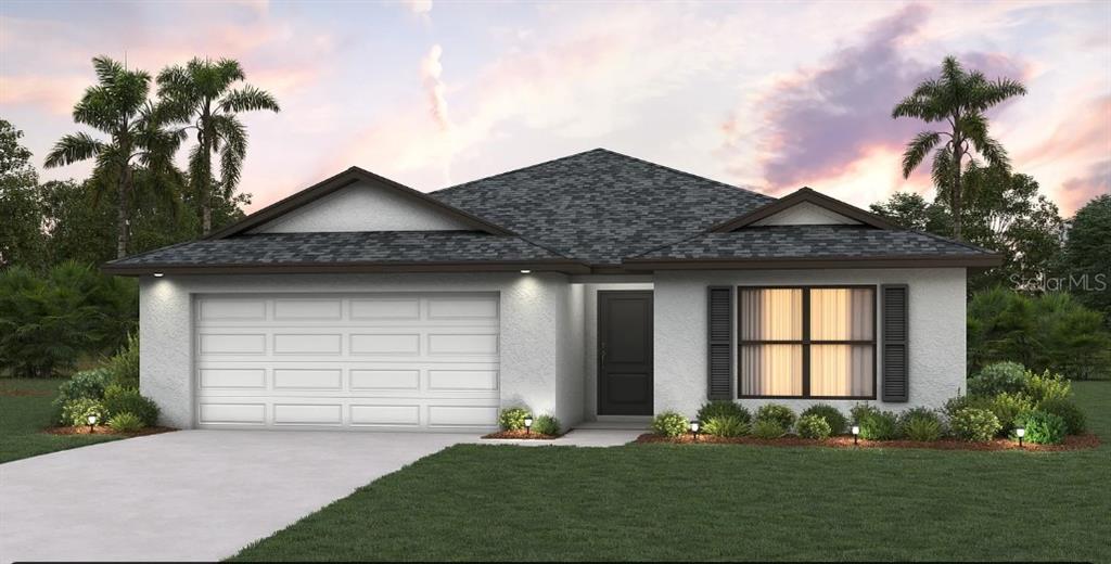 6375 Ceres Street Englewood, FL 34224 - Photo 7 of 14 a front view of a house with a yard and garage