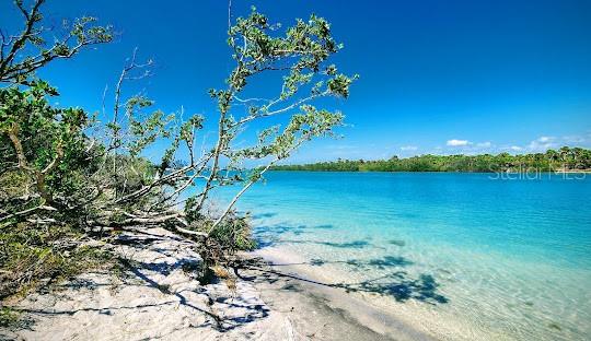 6375 Ceres Street Englewood, FL 34224 - Photo 9 of 14 a view of a lake with a house in the background