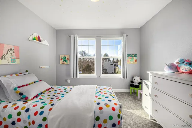 a bedroom with a bed and a window in it