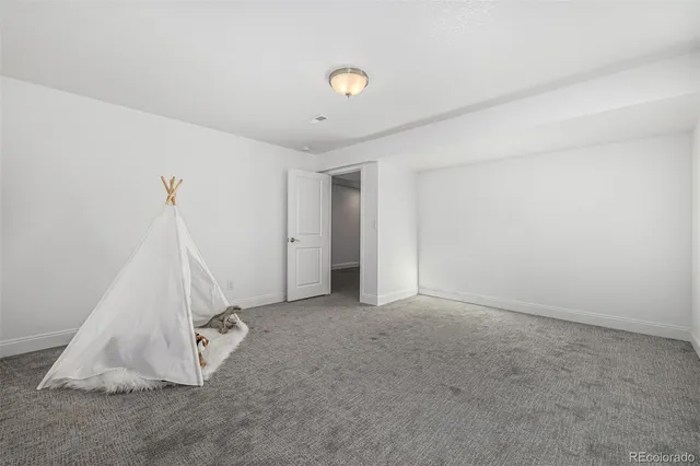 a bathroom with a sink a toilet a shower and a mirror