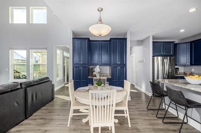 a view of a dining room with furniture window and wooden floor