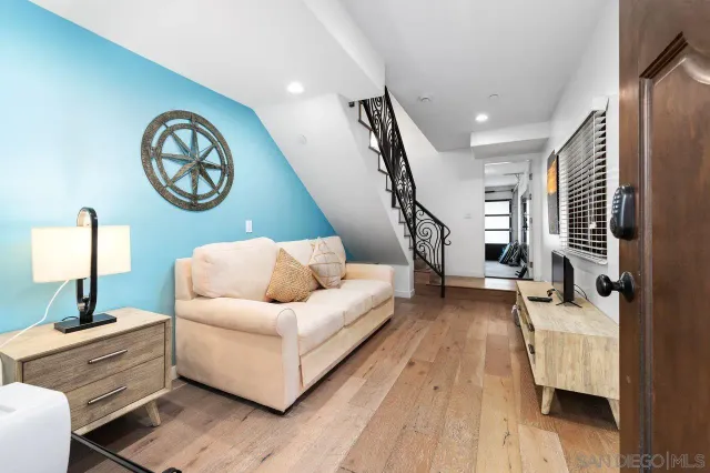 a bathroom with a shower sink and mirror