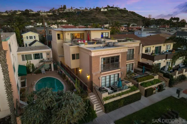 a spacious bedroom with a bed and a couch