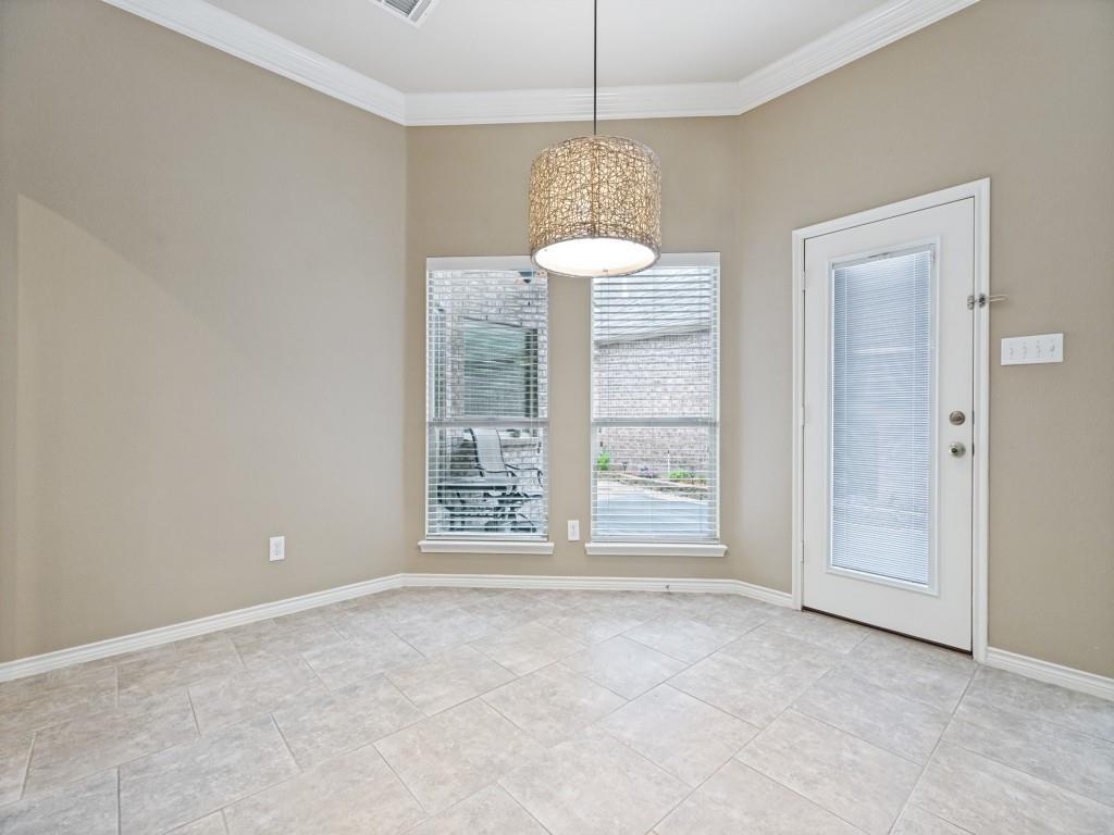 10032 Bell Rock Road Frisco, TX 75035 - Photo 15 of 23 Recessed corner featuring tile flooring and crown molding.