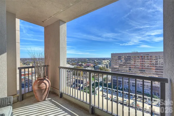 a view of balcony with wooden floor
