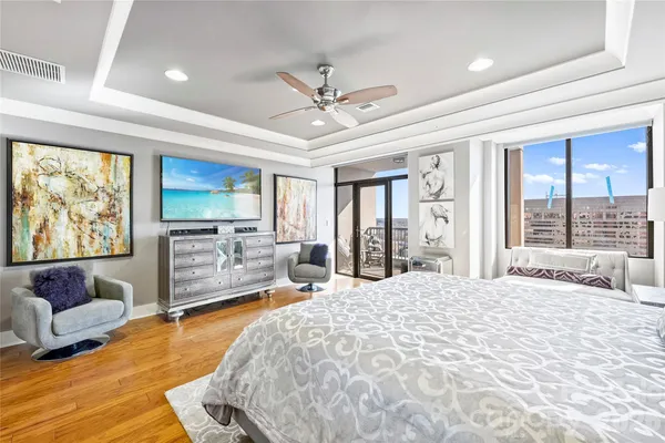 a bedroom with a large bed and a couch