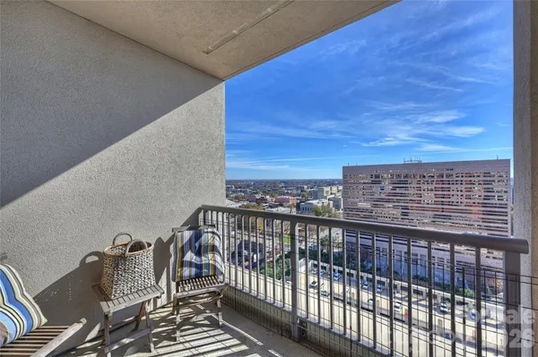 a view of balcony with furniture