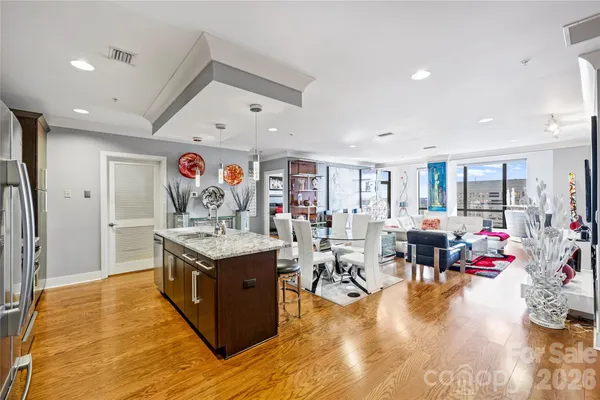 a view of a living room and kitchen