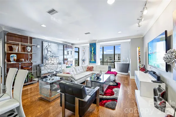a living room with furniture and a flat screen tv
