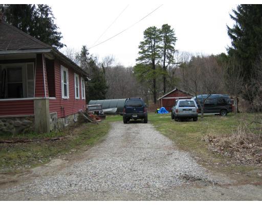 12 Riverside Park Maynard, MA 01754 - Photo 2 of 2 a car parked in front of a house