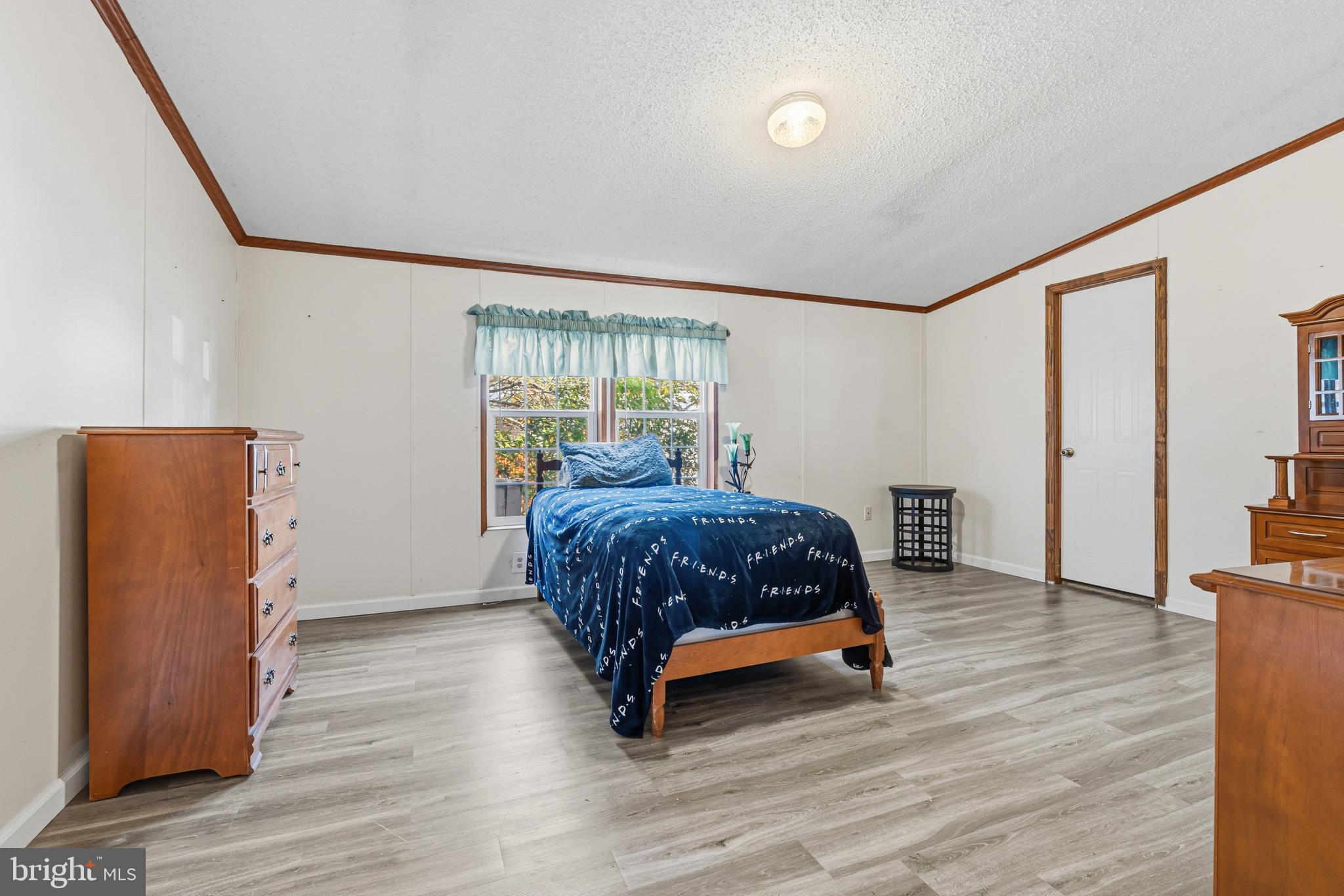 1834 Emily Drive Edgewood, MD 21040 - Photo 12 of 42 a bedroom with a bed and wooden floor