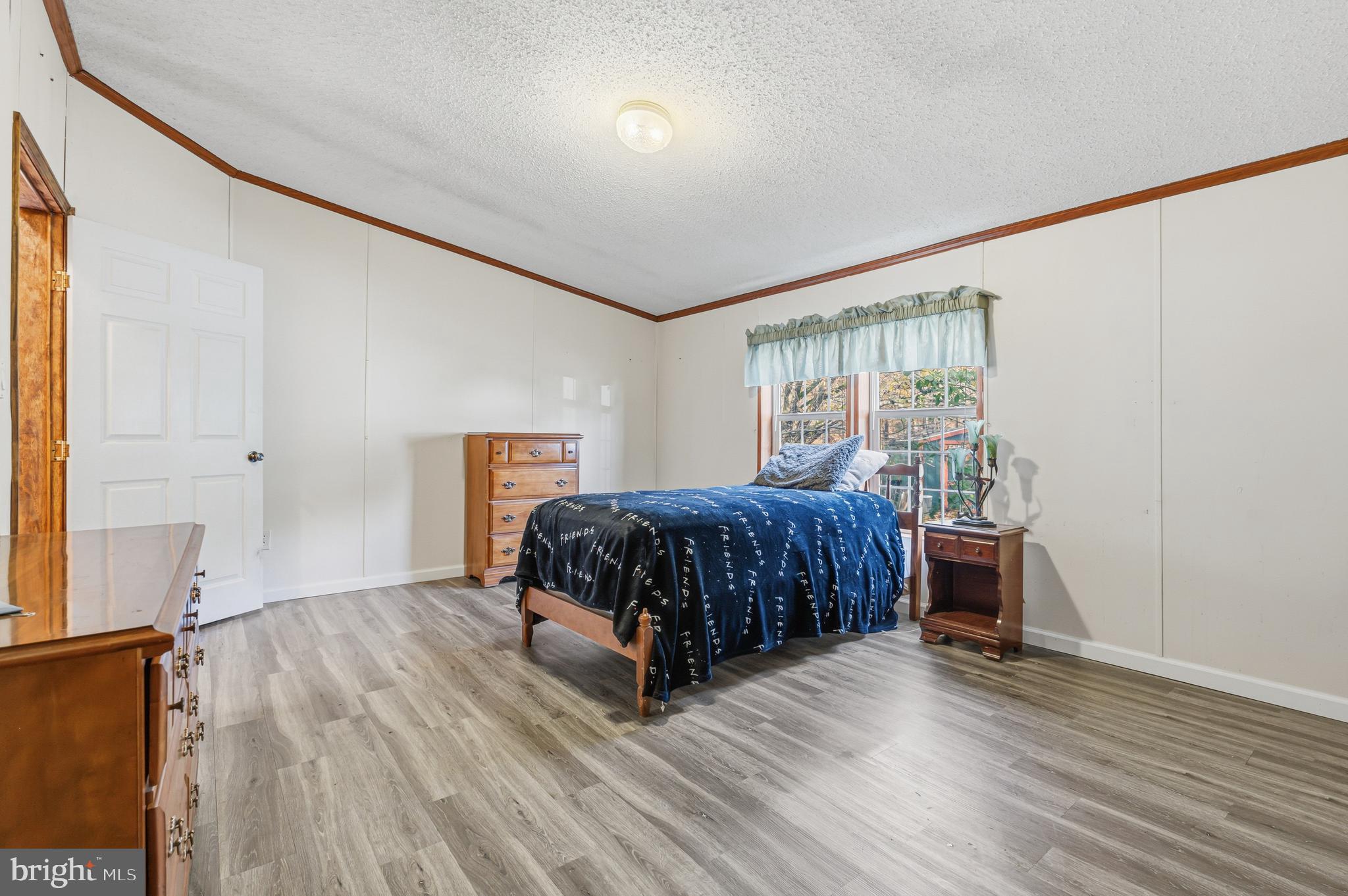 1834 Emily Drive Edgewood, MD 21040 - Photo 14 of 42 a bedroom with a bed and wooden floor