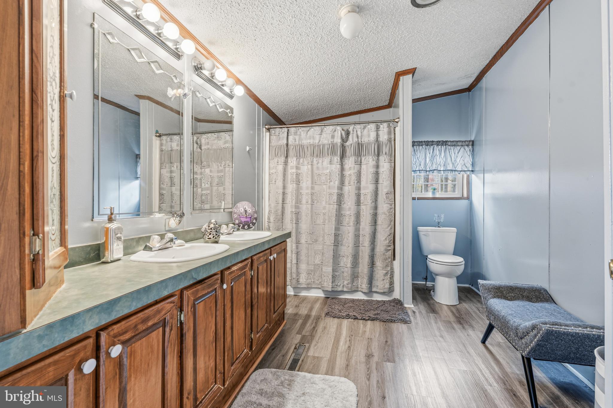 1834 Emily Drive Edgewood, MD 21040 - Photo 22 of 42 a bathroom with a sink a toilet a mirror and shower
