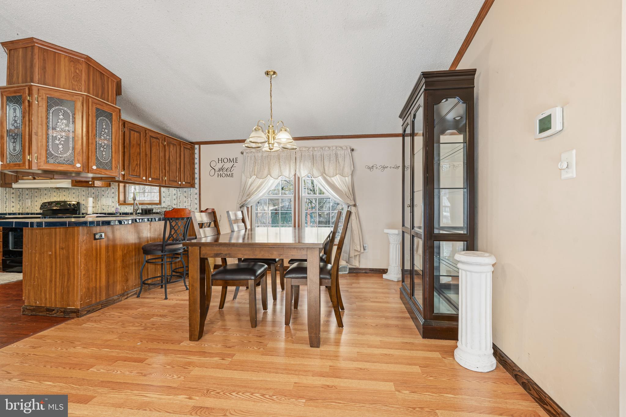 1834 Emily Drive Edgewood, MD 21040 - Photo 6 of 42 a dining room with furniture a chandelier and wooden floor