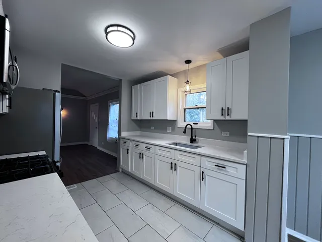 a kitchen with cabinets and sink
