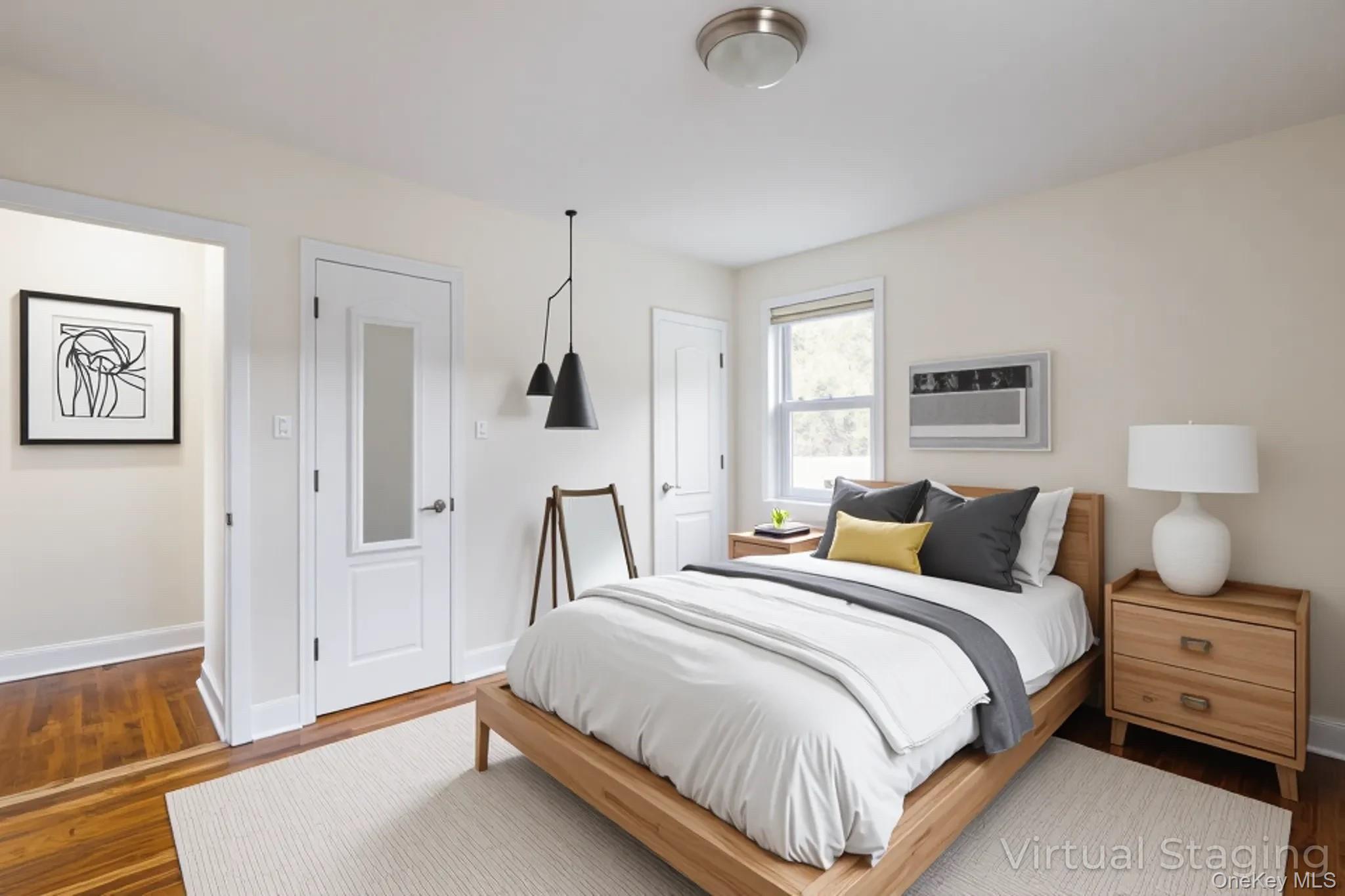 251-41 71st Road, Unit 54B Queens, NY 11426 - Photo 14 of 20 a bedroom with a bed and wooden floor