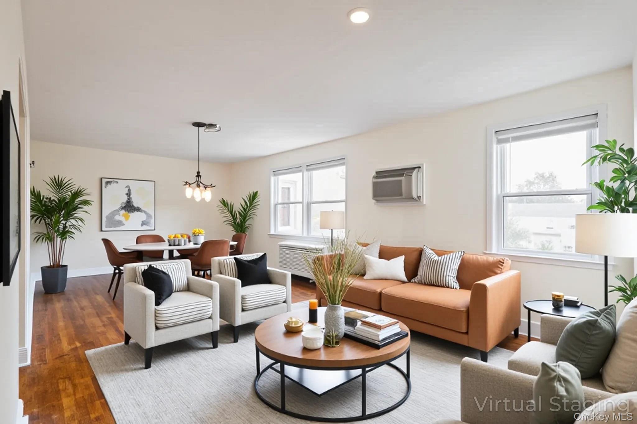 251-41 71st Road, Unit 54B Queens, NY 11426 - Photo 7 of 20 a living room with furniture a table and a window