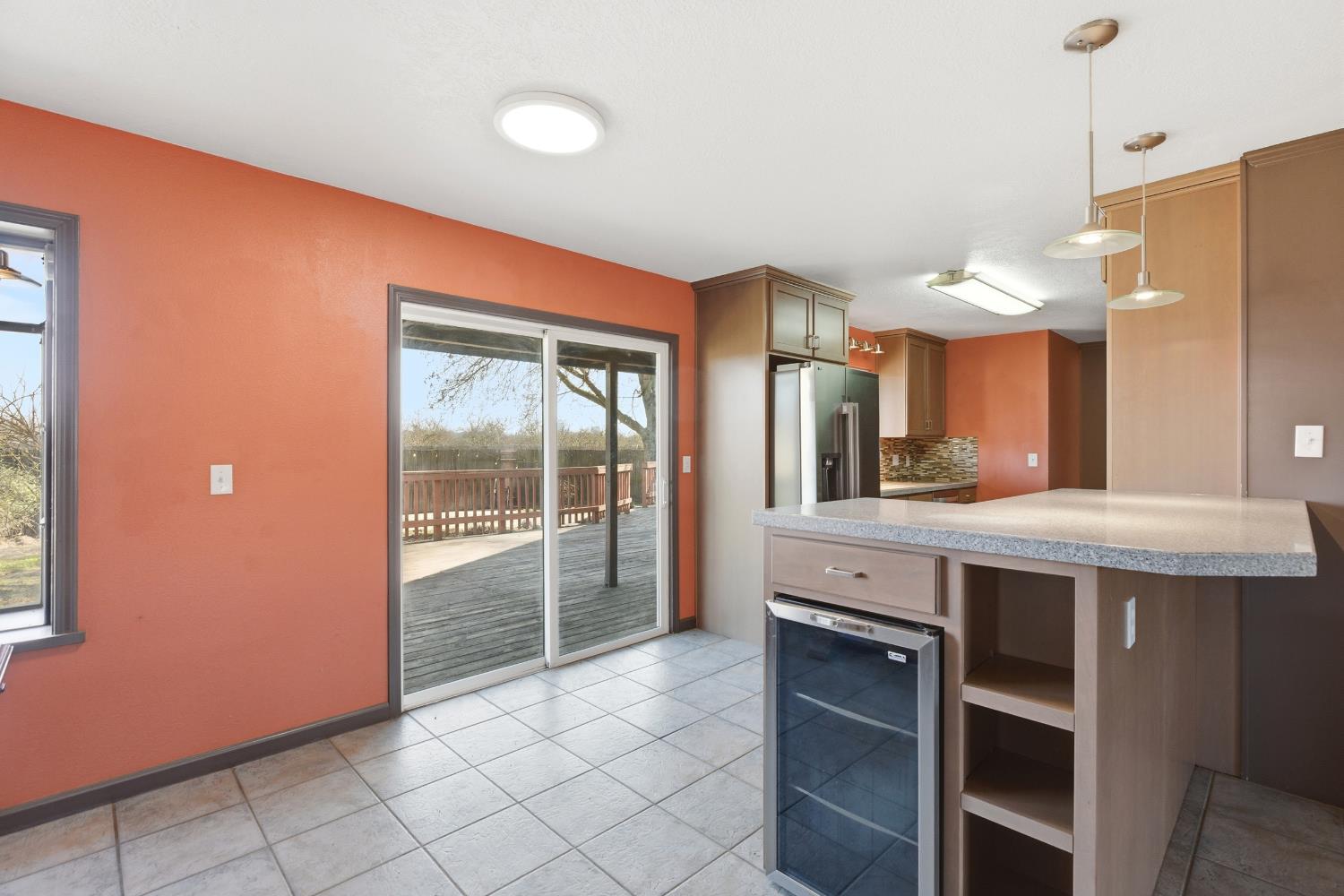 4224 Griffin Road Hughson, CA 95326 - Photo 12 of 46 a kitchen with stainless steel appliances kitchen island granite countertop a refrigerator and a sink