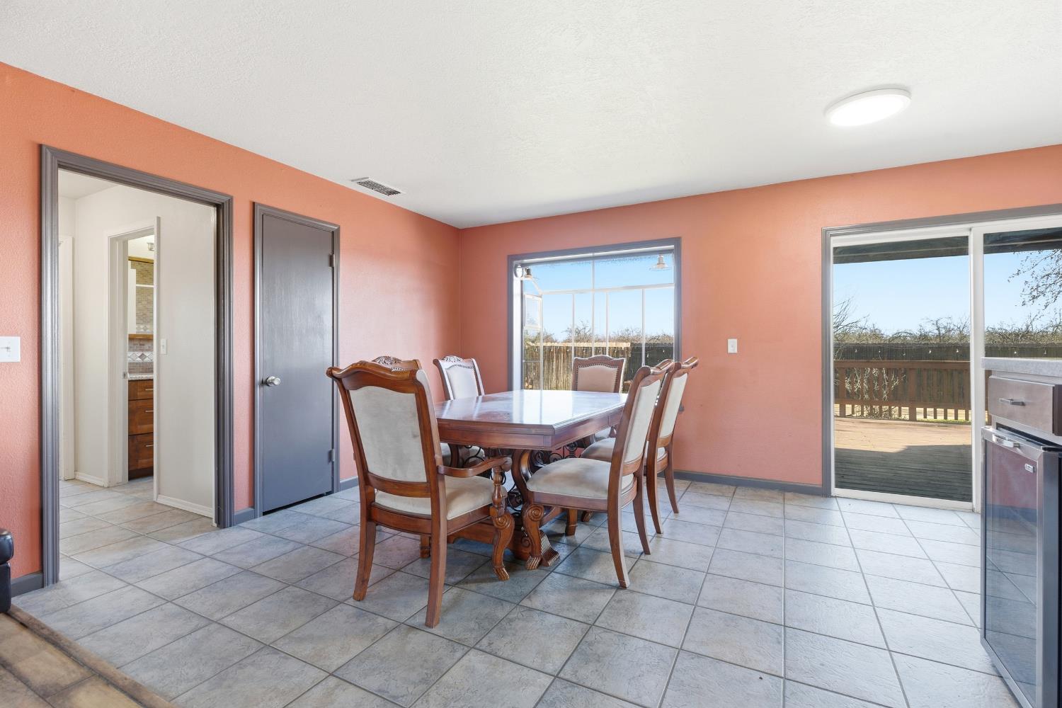 4224 Griffin Road Hughson, CA 95326 - Photo 13 of 46 a dining room with furniture and large windows