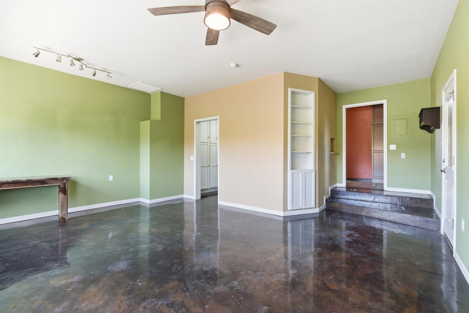 4224 Griffin Road Hughson, CA 95326 - Photo 27 of 46 a view of a livingroom with wooden floor and a ceiling fan