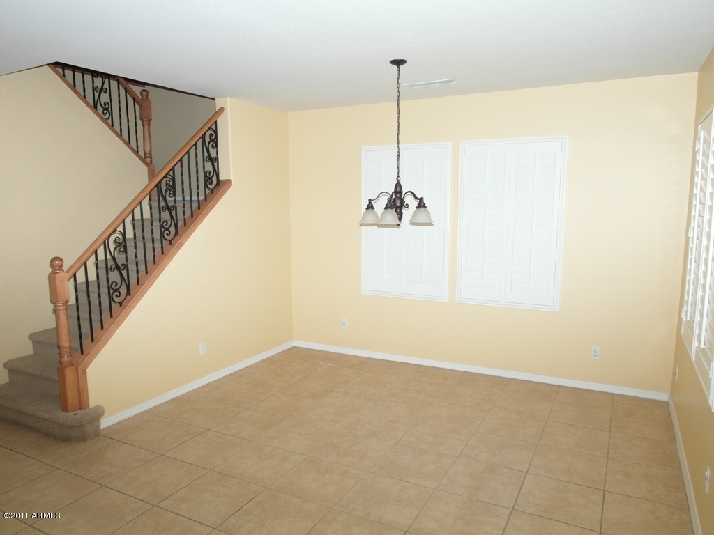20779 West Ridge Road Buckeye, AZ 85396 - Photo 3 of 23 a view of an empty room with stairs