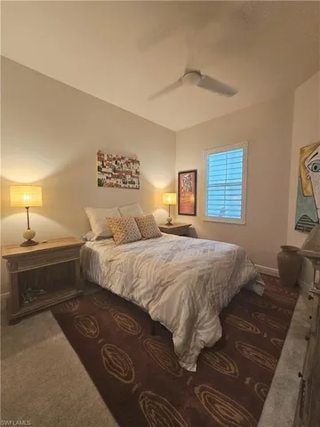 a spacious bedroom with a bed and a walk in closet