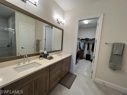 a spacious bedroom with a bed and a walk in closet