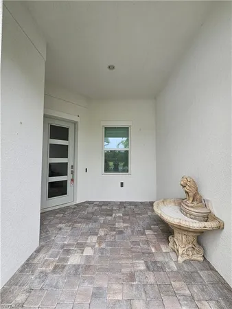 a view of a room with a small space and a window