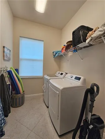 a white toilet sitting next to a white wall