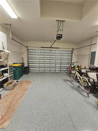 a view of an outdoor sitting area with furniture and umbrella