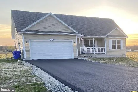 a front view of a house with a garage
