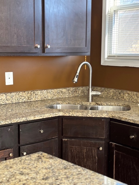 1500 East 73rd Street, Unit 3 Chicago, IL 60619 - Photo 6 of 13 a bathroom with a granite countertop sink and a cabinets
