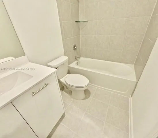 a bathroom with a sink a toilet and a bathtub