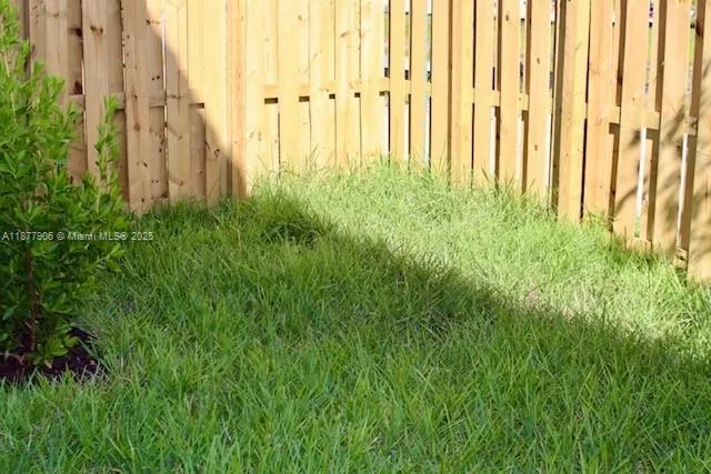 a view of small yard with plants