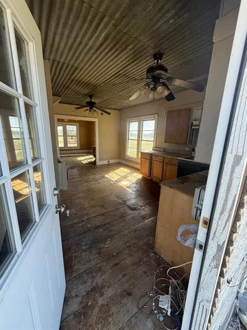 a view of an entryway with wooden floor