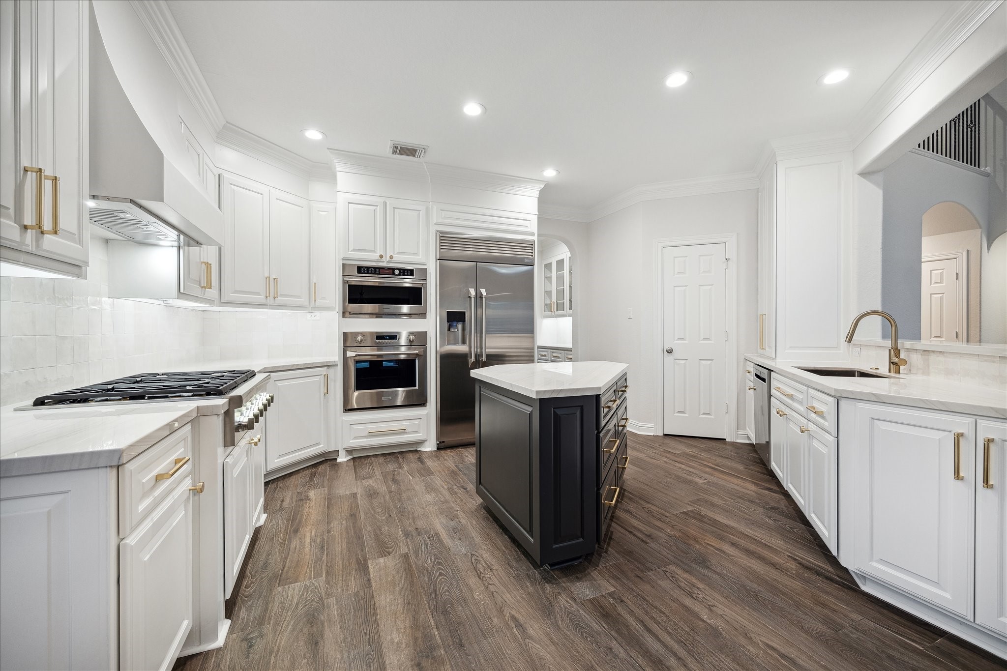 6211 Alameda Point Lane Houston, TX 77041 - Photo 12 of 50 Chef's kitchen with island, Thermador 6-burner gas cooktop, new sub-zero refrigerator, custom white cabinetry, and abundant storage throughout.