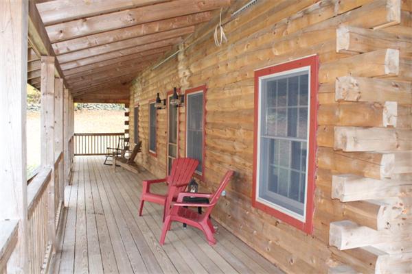 386 Piper Road Ashby, MA 01431 - Photo 20 of 24 a balcony with furniture and wooden floor