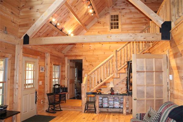 386 Piper Road Ashby, MA 01431 - Photo 2 of 24 a view of a balcony with wooden floor and fence