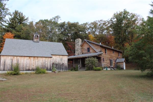386 Piper Road Ashby, MA 01431 - Photo 21 of 24 front view of a house with a street