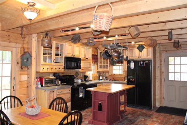 386 Piper Road Ashby, MA 01431 - Photo 6 of 24 a kitchen with a refrigerator and a stove top oven