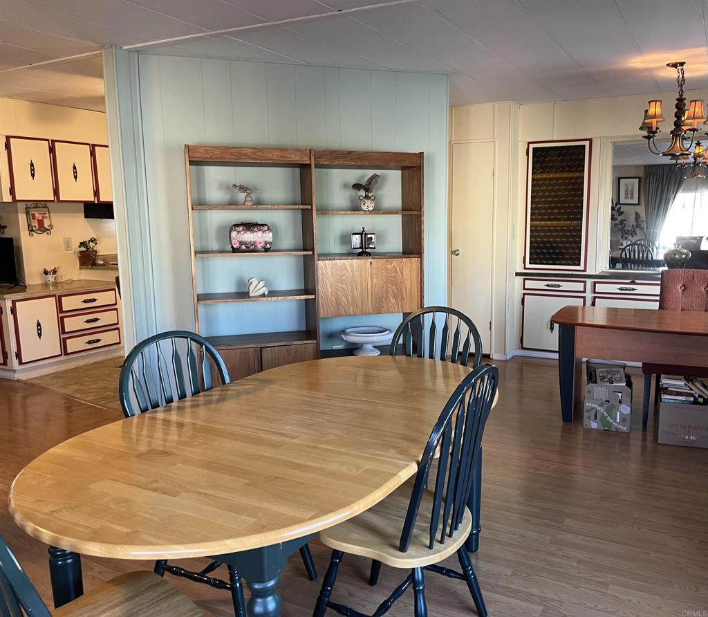 1810 Hillsdale Road, Unit 99 El Cajon, CA 92019 - Photo 7 of 15 a dining room with furniture and wooden floor