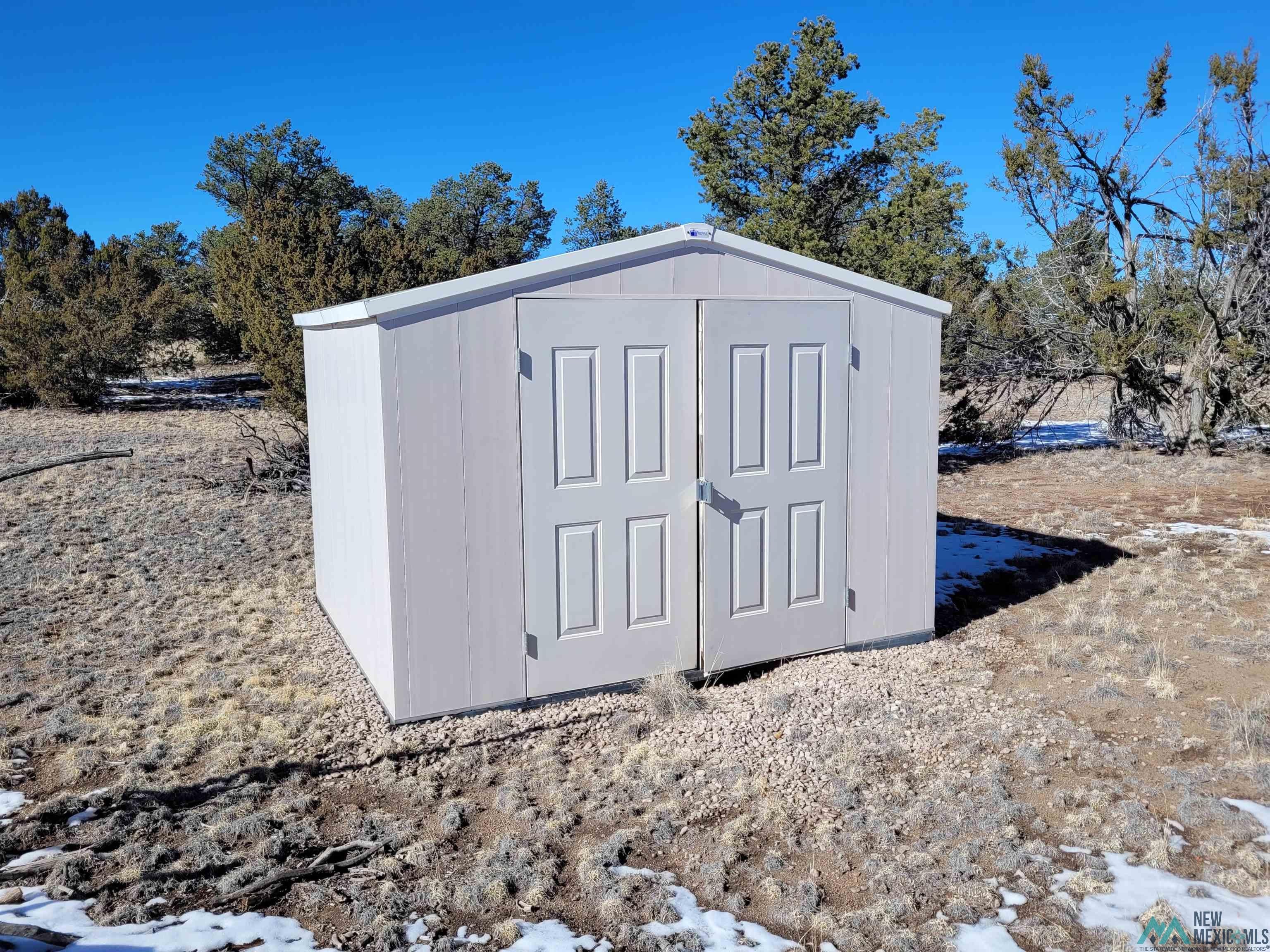 1 Jackass Lane, Unit 1 Datil, NM 87821 - Photo 13 of 46 Snow covered structure featuring a shed