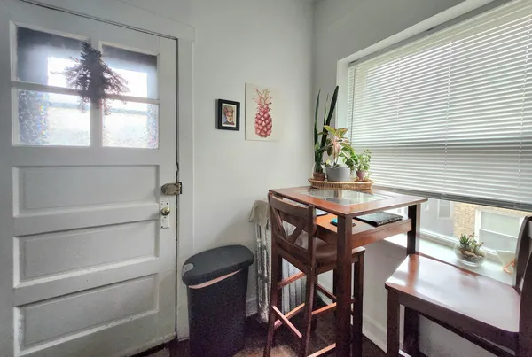 a view of a workspace room with furniture and wooden floor