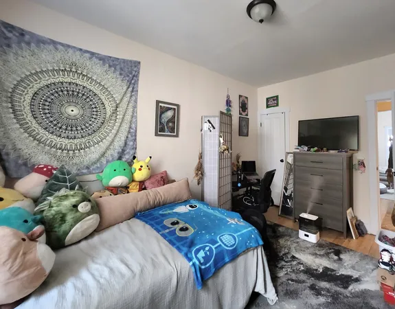a bedroom that has a bed and a tv in it