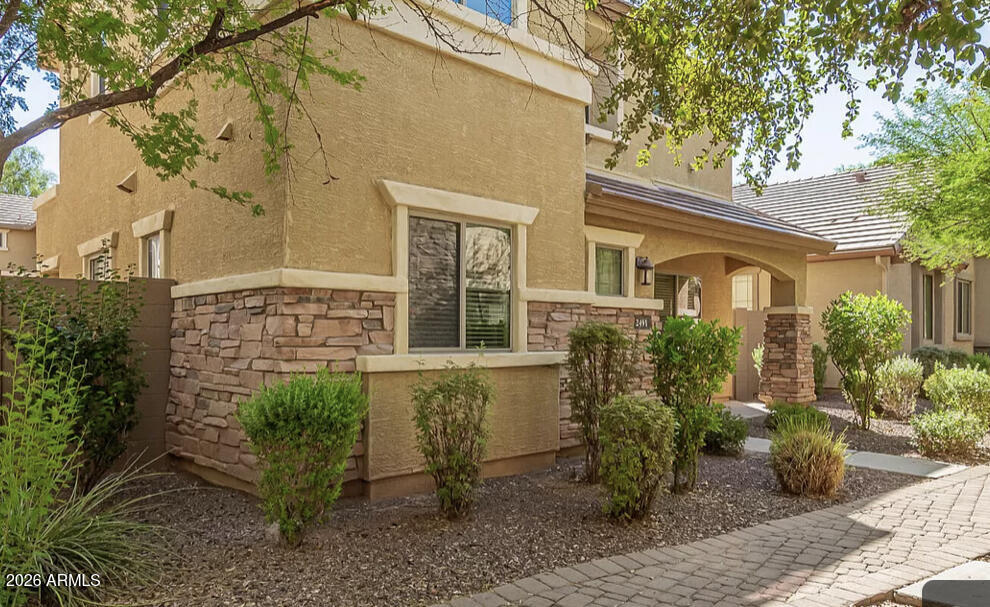 front view of a house with a garden