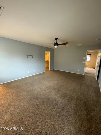 an empty room with a empty space and windows